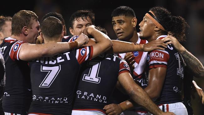 Sitili Tupouniua (right) scores for the Roosters (Photo by Albert Perez/Getty Images)