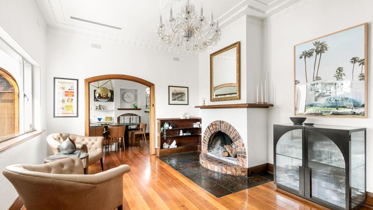 An open fire place in the sitting room.