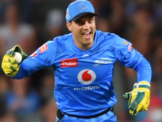 ADELAIDE, AUSTRALIA - JANUARY 21: Alex Carey of the Strikers celebrates after catching the wicket of  Joe Burns of the Heat during the Big Bash League match between the Adelaide Strikers and the Brisbane Heat at Adelaide Oval, on January 21, 2021, in Adelaide, Australia. (Photo by Mark Brake/Getty Images)