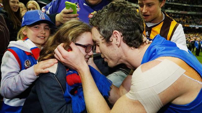 Robert Murphy kisses his daughter after his retirement. Picture: Getty Images