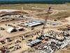 Bridge, big machines: New photos as $1b Qld mine takes shape