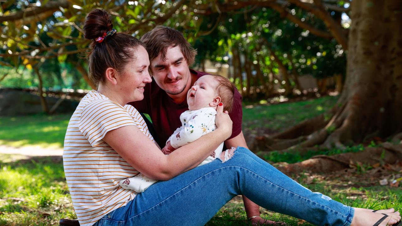 Jessie Evans and Billy Blacker with their son Rocka, 4 months, in Double Bay. The Western Downs family traveled to NSW for medical treatment for Rocka. Now they are having trouble getting back home. Picture: Justin Lloyd.