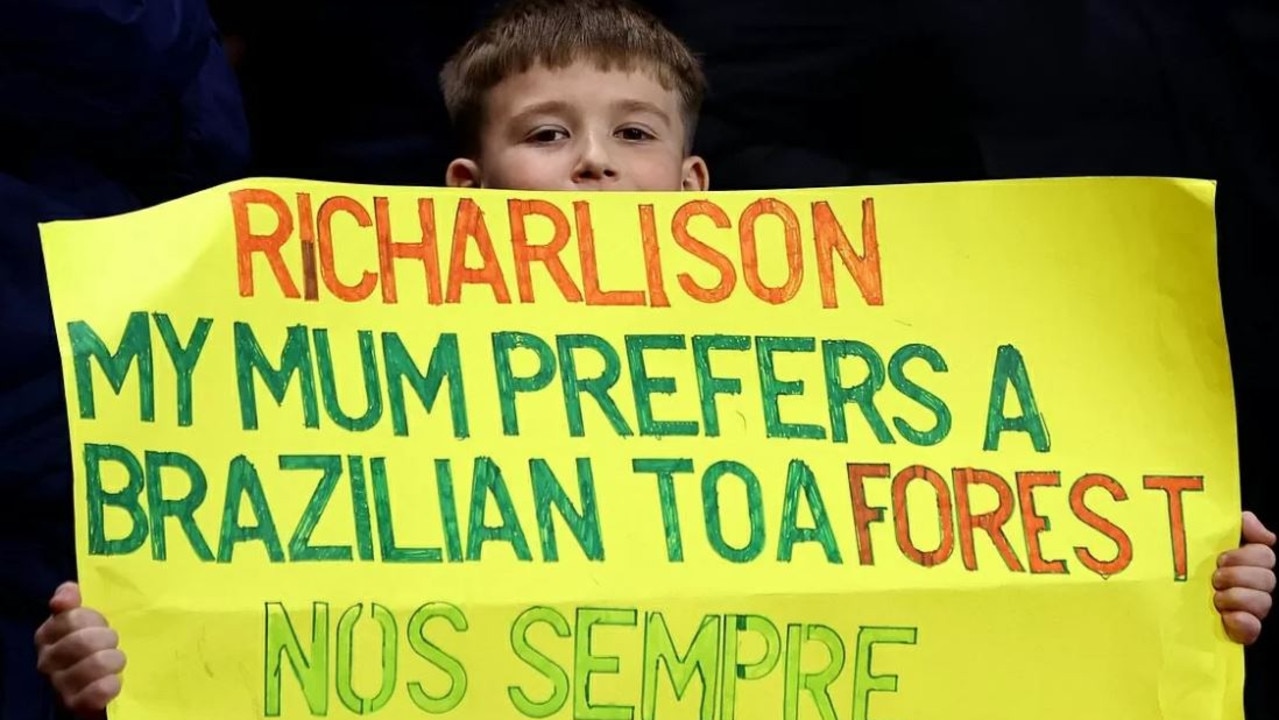 Part of the bilingual sign held by a young fan at the game. Photo: Twitter