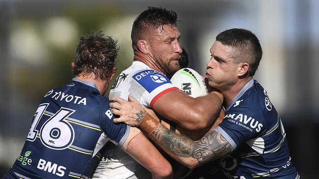 ROCKHAMPTON, AUSTRALIA - AUGUST 28: Tariq Sims of the Dragons is tackled by Ben Hampton and Mitch Dunn of the Cowboys during the round 24 NRL match between the St George Illawarra Dragons and the North Queensland Cowboys at Browne Park, on August 28, 2021, in Rockhampton, Australia. (Photo by Ian Hitchcock/Getty Images)