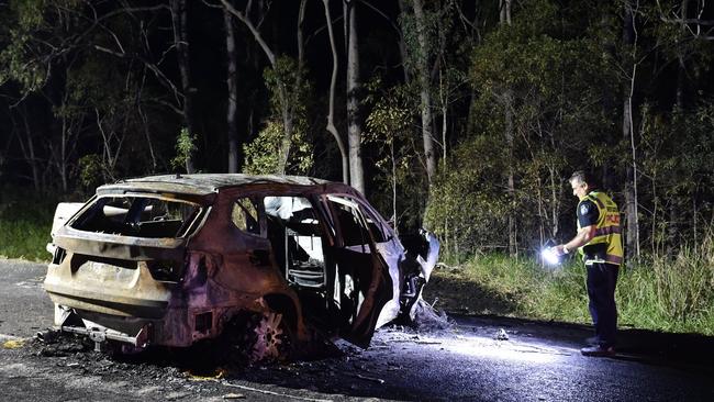 Crash investigators at the scene of a double fatality on the Bruce Highway two kilometres north of Tiaro.