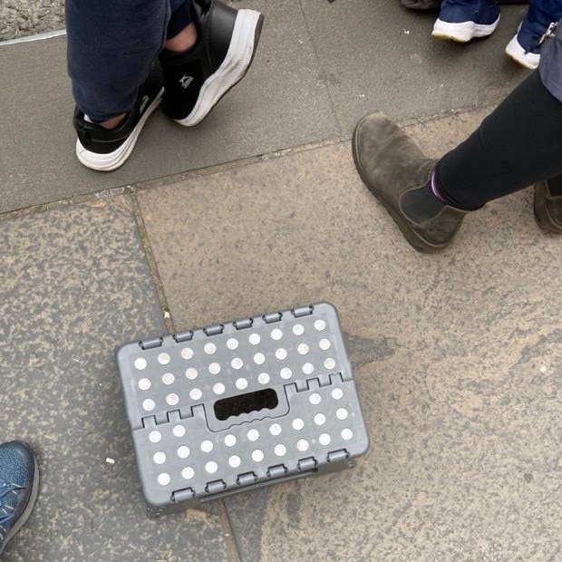 Alison Hayward brought a footstool to get a better view as the body and precession arrived from Balmoral. Picture: Supplied