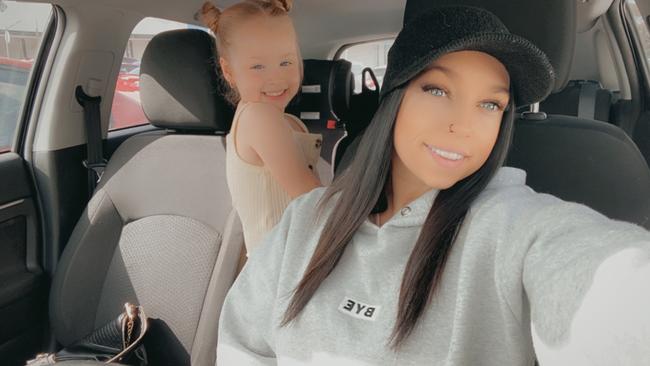 Ashley Evans is fighting her health insurance company after they refused to cover vital surgery to remove an orange-size mass on her right ovary, with her six-year-old daughter Charlotte. Picture: Supplied