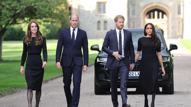 The brothers and their wives perform a walkabout after the Queen’s death in September.