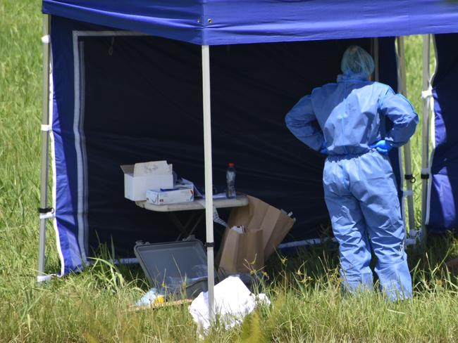 Police in a vacant area off the Bruce Highway at Paget about 100m from The Park caravan park where a 25-year-old man's body was allegedly found about 3am on Tuesday, December 14, 2021. Picture: Matthew Forrest