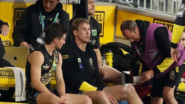 MELBOURNE, AUSTRALIA - MAY 21: Tom J. Lynch of the Tigers looks on from the bench after being subbed out of the game during the 2022 AFL Round 10 match between the Richmond Tigers and the Essendon Bombers at the Melbourne Cricket Ground on May 21, 2022 in Melbourne, Australia. (Photo by Dylan Burns/AFL Photos via Getty Images)