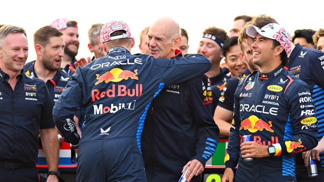 Max Verstappen celebrates with Adrian Newey, the Chief Technical Officer of Oracle Red Bull Racing, alongside Christian Horner and Sergio Perez. Photo by Clive Mason/Getty Images.