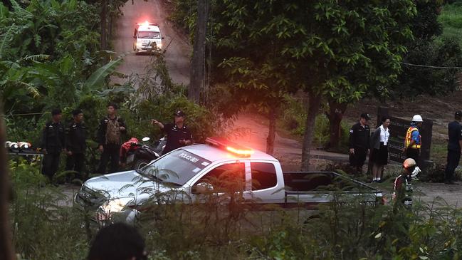 An ambulance and an escort vehicle leave the Tham Luang cave area. Picture: AFP
