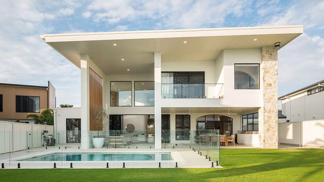 The house is a newly finished build, covered with quartz stone along its walls, pillars and archways.