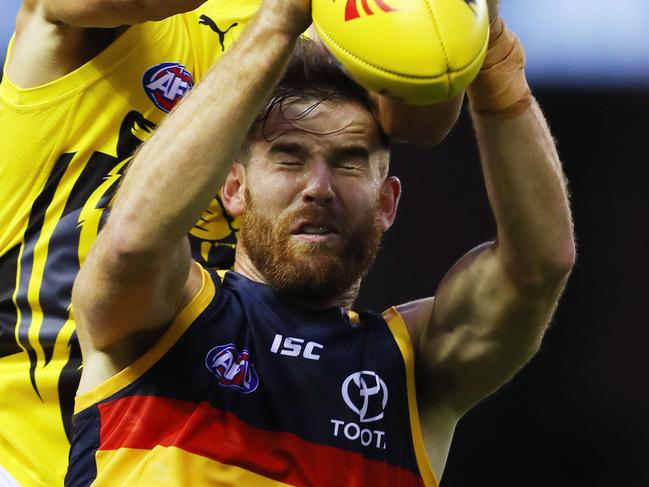 JLT Pre Season match. Richmond V Adelaide at Etihad Stadium. Andy Otten marks infant of Ben Griffiths .Pic : Michael Klein