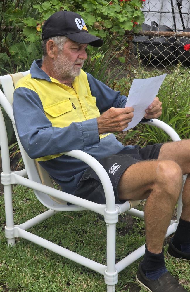 Robin Rabbitt reads a letter from a Queensland coroner informing him no inquest will be held into the death of his son. Picture: Supplied