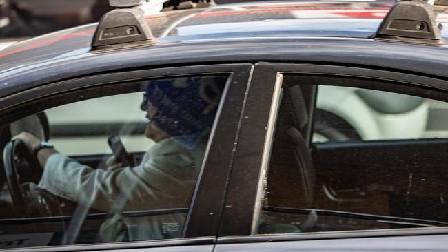 A driver caught on their phone on Victoria Road, West Ryde, last Friday. AAP IMAGE/MONIQUE HARMER