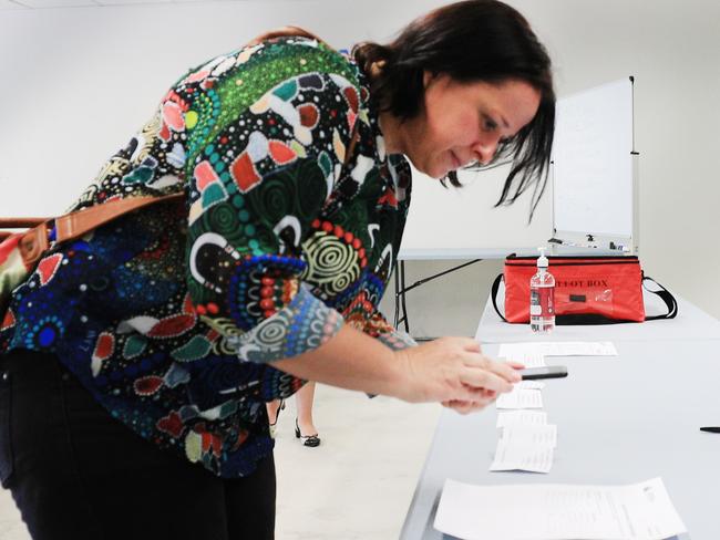 11th October 2020, Suzette Luyken candidate from the Legalise Cannabis Qld Party  inspects the Queensland State Election Ballot Draw for Gaven on the Gold Coast.Photo: Scott Powick News Corp