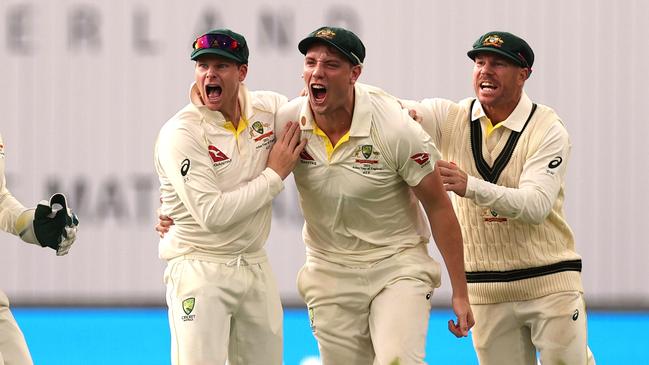 Cameron Green of Australia celebrates catching out Ben Duckett of England from the bowling of Pat Cummins. Photo: Getty.