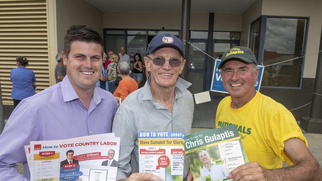 Labor candidate Trent Gilbert, Shooters Fishers and Farmers candidate Steve Cansdell with Nationals candidate Chris Gulaptis outside the King St prepoll on the eve of the state election in Grafton, 2019.