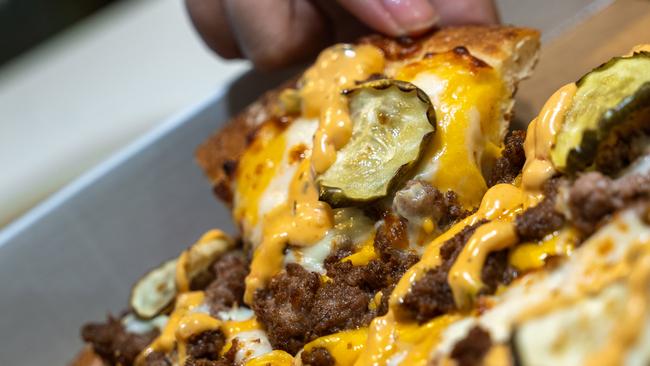 Dominoes' new Burger Joint experience features their take on a Cheeseburger. Picture: Supplied