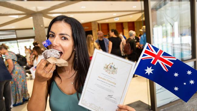 Rafaela Nascimento, originally from Brazil, enjoys a taste of Australia at a morning tea after the ceremony.