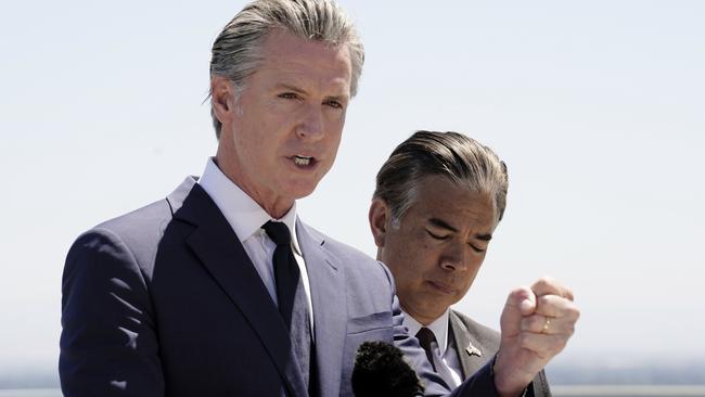 Standing atop the Cal. EPA building, Calif. Gov. Gavin Newsom discusses the U.S. Senates vote against California Emissions rules which include the ban on the sale of new gas powered cars by 2035. Sacramento, Calif., Thursday May 22, 2025. At right is California Attorney General Rob Bonta. (Photo/Rich Pedroncelli)