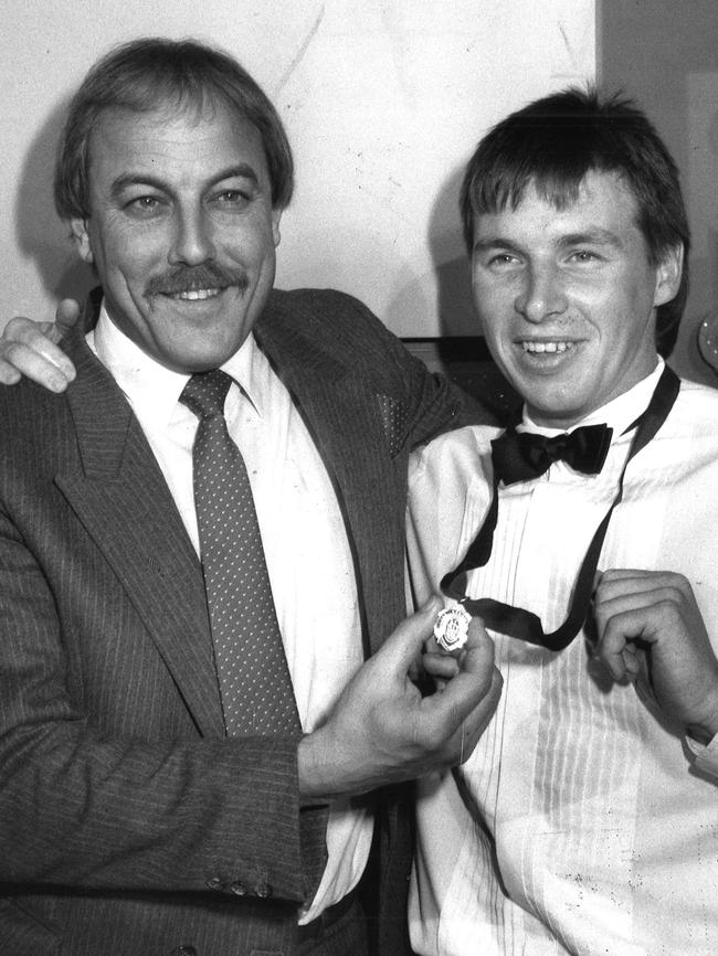 Couch celebrating his 1989 Brownlow medal with coach Malcolm Blight.