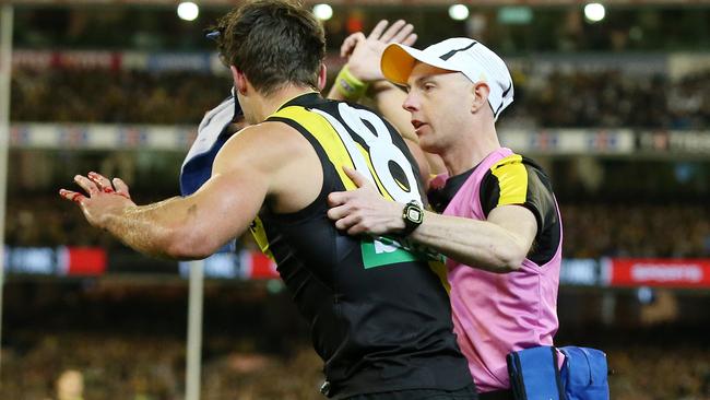 Alex Rance give the trainer the wave off after headbutting Harry Taylor’s knee. Picture: Michael Klein