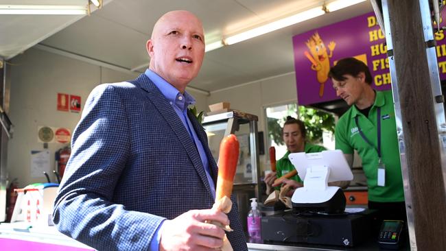 Federal Opposition Leader Peter Dutton purchased some Dagwood Dogs during his Ekka visit on Wednesday. Picture: NCA NewsWire / Dan Peled