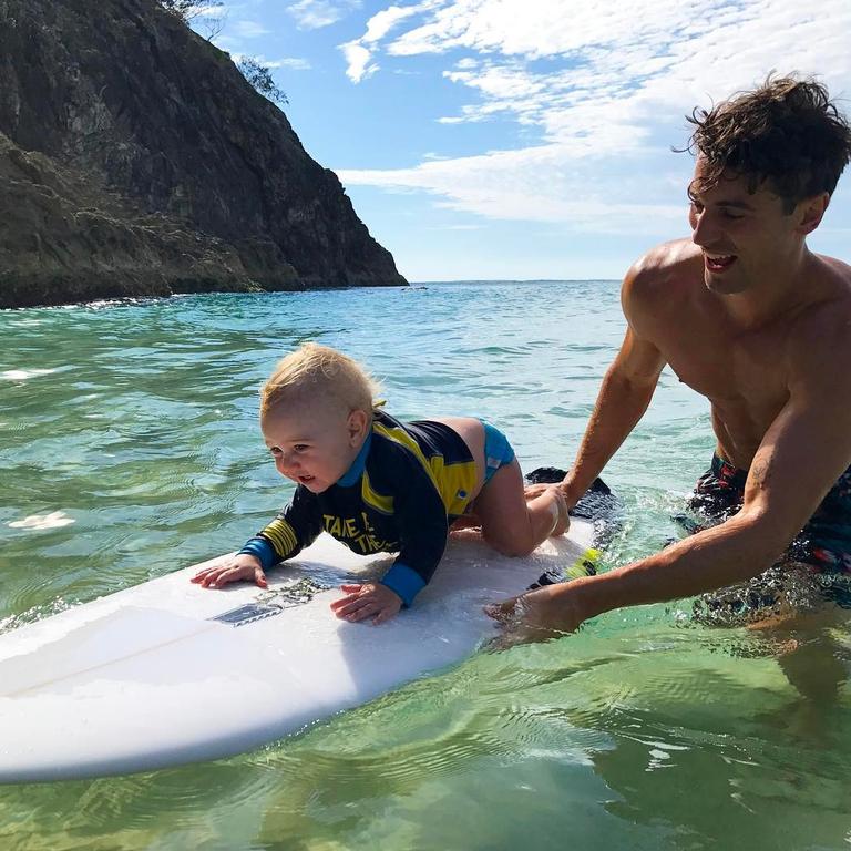 Matty Johnson in Stradbroke Island ... “Took the little rooster out for his first surf today.” Picture: @matthewdavidjohnson/Instagram