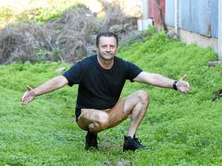 Curra resident Milan Katic shows the size of the 'big cat' he saw crossing his property. Picture: Frances Klein