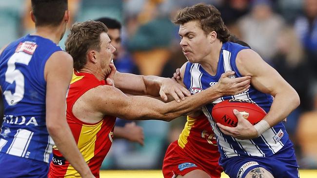 Cameron Zurhaar fends off a tackle from Nick Holman. Picture: Getty