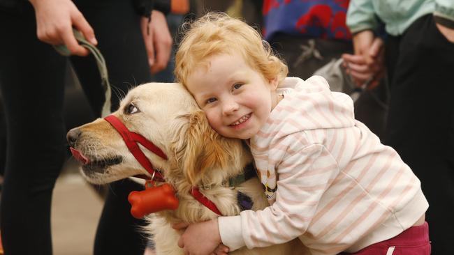 Bethany hugs her dog, Sloane, before going aboard. Picture: David Caird