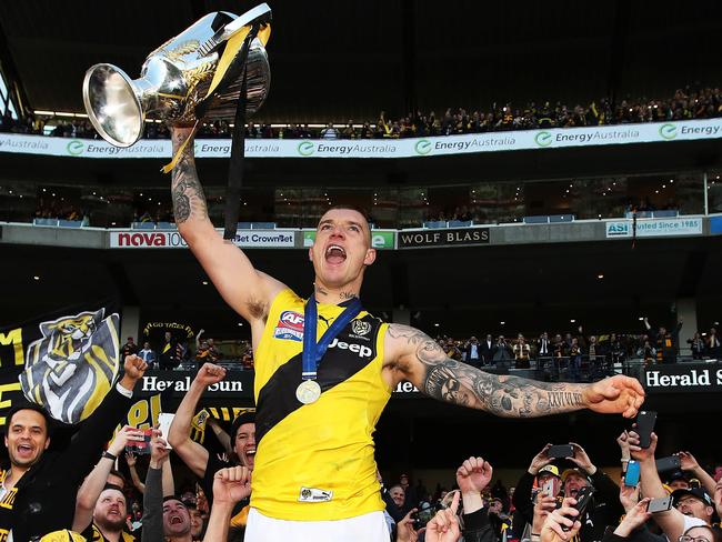 The Tiger's Dustin Martin celebrates with the Premiership Cup after Richmond defeated the Adelaide Crows in the 2017 AFL Grand Final at the MCG. picture. Phil Hillyard