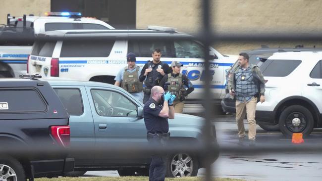 Police investigate as emergency vehicles are parked outside the Abundant Life Christian School. Picture: AP Morry Gash