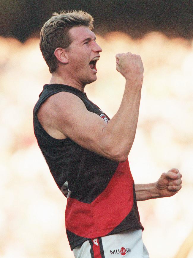 Hird celebrates a goal in the final term in the game between the Bombers and the Pies in April 2000. The Bombers went on to win the flag that season. Photo: George Sal