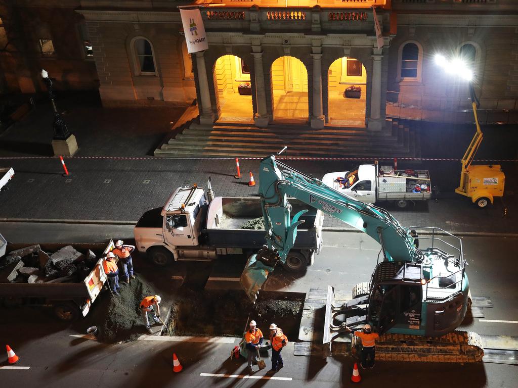 Work in Macquarie Street Hobart on the hole that will house the chamber performance artist Mike Parr will live in for 72 hours during Dark MOFO. Picture: NIKKI DAVIS-JONES