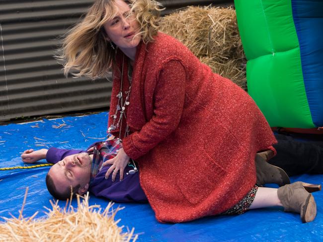 Moloney on the Neighbours set in 2015 playing an injured Toadie after trying to stop an out of control jumping castle. Picture: Supplied