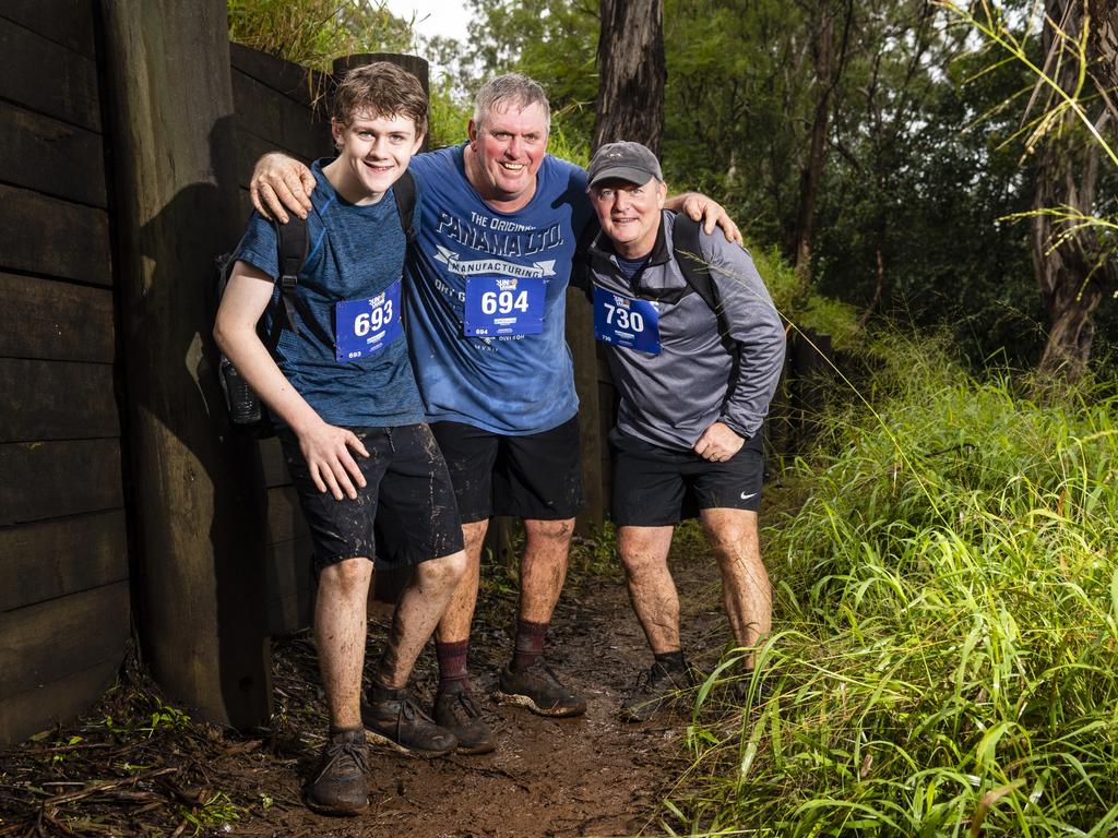 Enjoying the wet and muddy conditions are (from left) Alexander Phelan, James Phelan and Steve Stockley in Run the Range Milne Bay Challenge 2022 in Jubilee and Redwood Parks, Sunday, May 22, 2022. Picture: Kevin Farmer