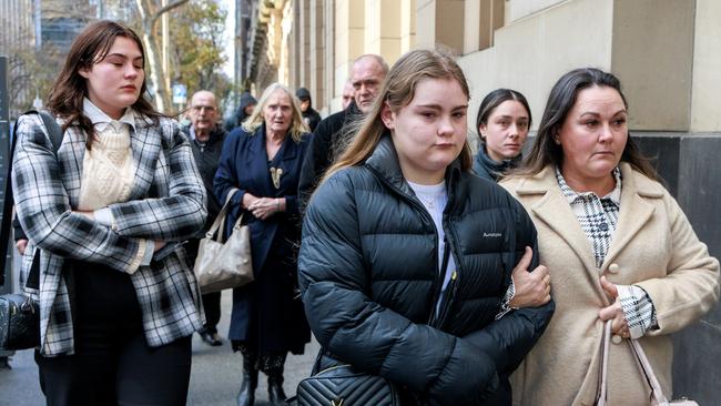 Family and friends of Jason Lanhans’ family outside the Supreme Court of Victoria. Picture: David Geraghty