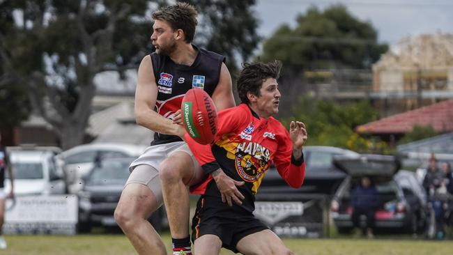 SFL: Frankston Dolphins and Hallam players didn’t see where the ball went. Picture: Valeriu Campan