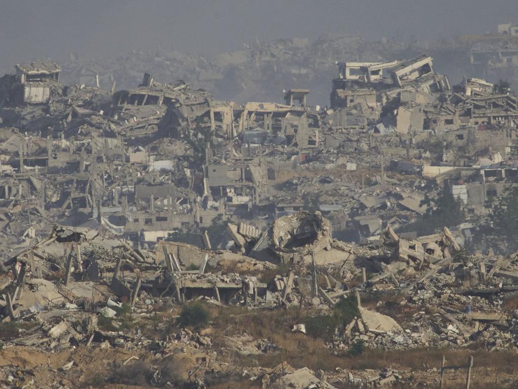Destroyed buildings in Gaza Strip are seen from southern Israel. Picture: AP Photo/Ariel Schalit