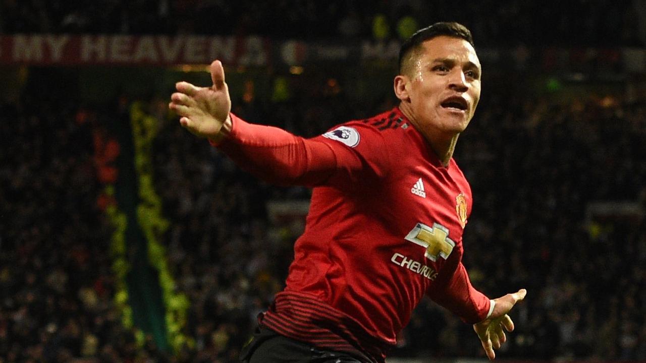 Manchester United's Chilean striker Alexis Sanchez celebrates after scoring the team's third goal during the English Premier League football match between Manchester United and Newcastle at Old Trafford in Manchester, north west England, on October 6, 2018. (Photo by Oli SCARFF / AFP) / RESTRICTED TO EDITORIAL USE. No use with unauthorized audio, video, data, fixture lists, club/league logos or 'live' services. Online in-match use limited to 120 images. An additional 40 images may be used in extra time. No video emulation. Social media in-match use limited to 120 images. An additional 40 images may be used in extra time. No use in betting publications, games or single club/league/player publications. /