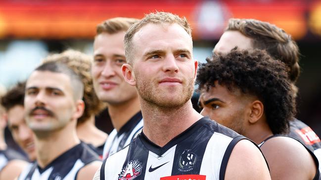 MELBOURNE, AUSTRALIA – APRIL 25: Tom Mitchell of the Magpies looks on during the Anzac Day observance ceremony during the 2023 AFL Round 06 match between the Collingwood Magpies and the Essendon Bombers at the Melbourne Cricket Ground on April 25, 2023 in Melbourne, Australia. (Photo by Dylan Burns/AFL Photos via Getty Images)