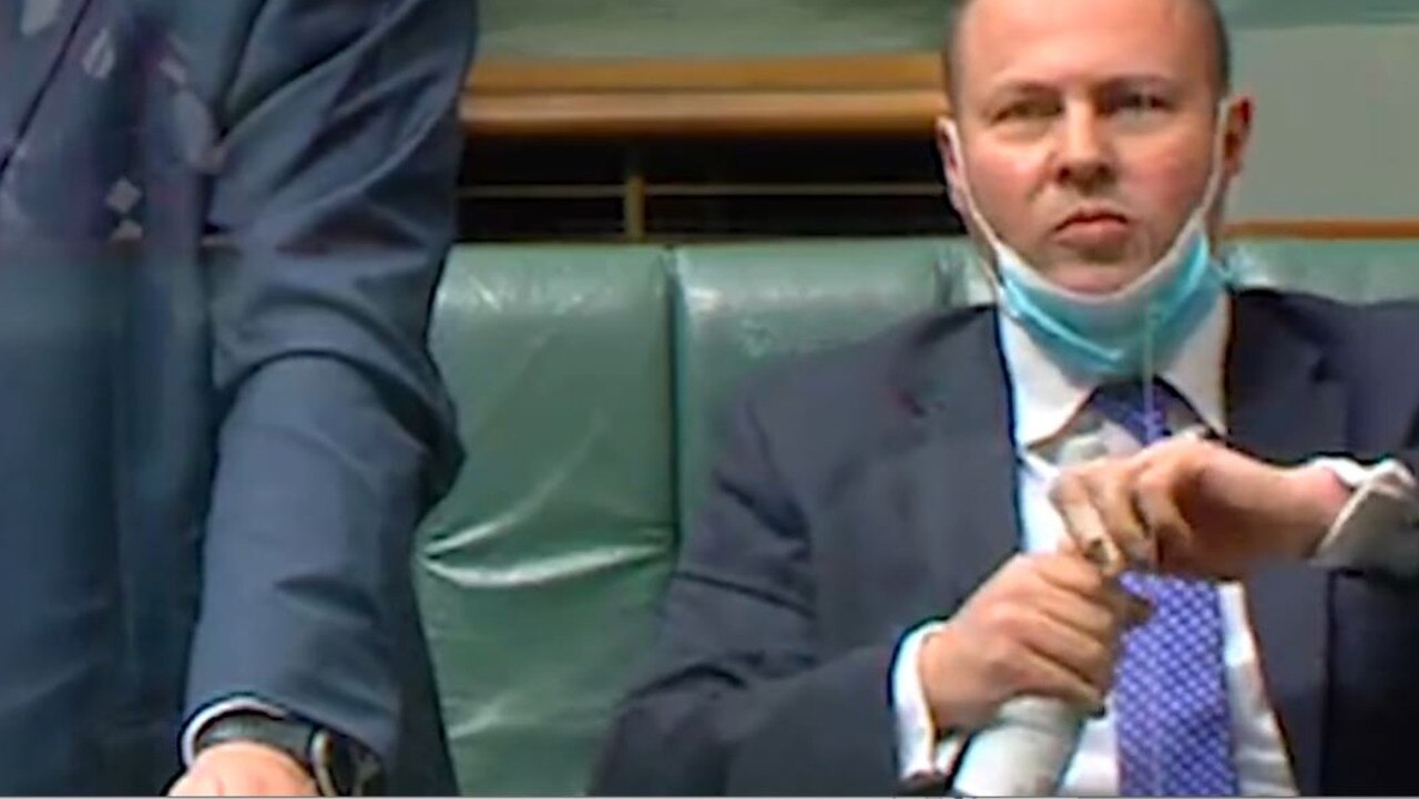 Josh Frydenberg struggles to open a bottle of water.