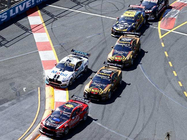 Coca-Cola Team Erebus driver Brodie Kostecki leads Penrite Team Grove driver David Reynolds on the first lap of the second race of the Gold Coast 500 V8 Supercars, held at the Surfers Paradise street circuit. Picture: Brendan Radke