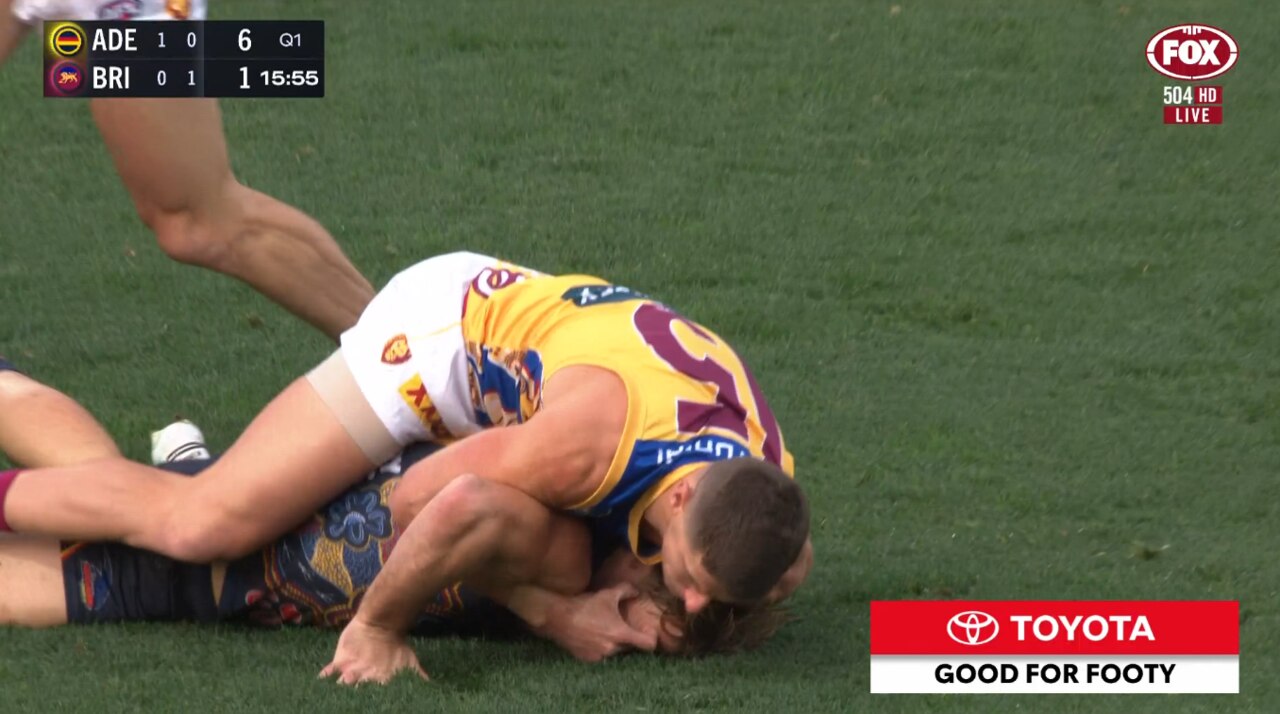 Dayne Zorko tangles with Luke Pedlar.