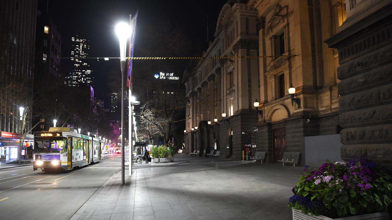 A solitary tram travels past Melbourne Town Hall. Picture: Josie Hayden