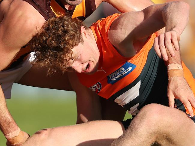 ADELAIDE, AUSTRALIA - APRIL 16: Conor Nash of the Hawks and Tom Green of the Giants during the 2023 AFL Round 05 match between the GWS Giants and the Hawthorn Hawks at Norwood Oval on April 16, 2023 in Adelaide, Australia. (Photo by Sarah Reed/AFL Photos via Getty Images)