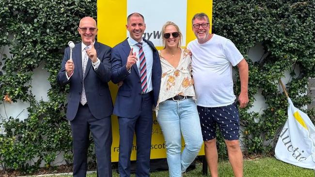 Richard and Sophie Didcott with the Ray White Ascot crew after the sale.